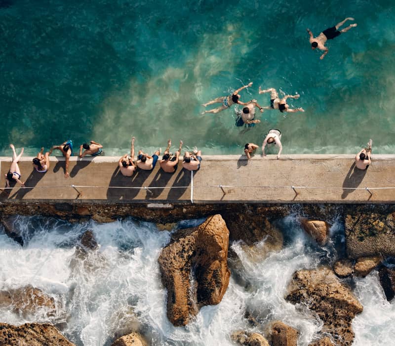 People sitting at Bronte Beach Sydney NSW