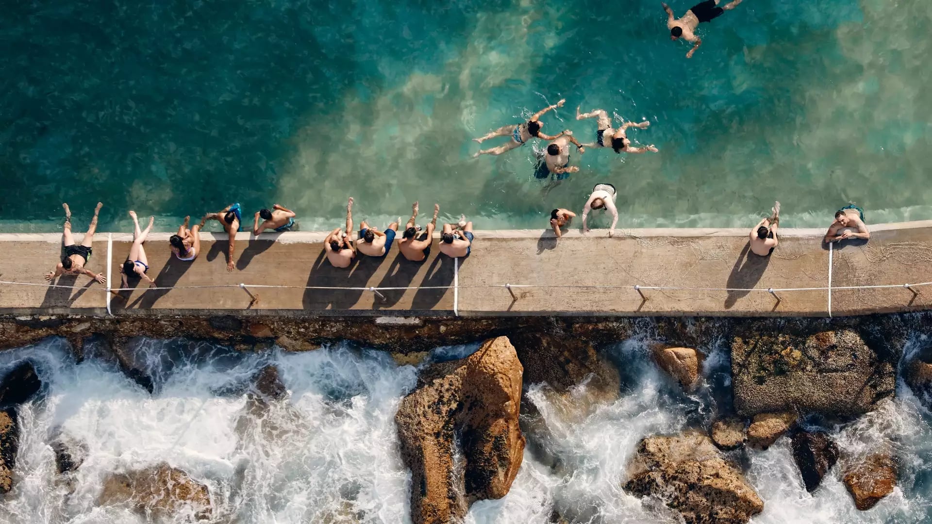 People sitting at Bronte Beach Sydney NSW