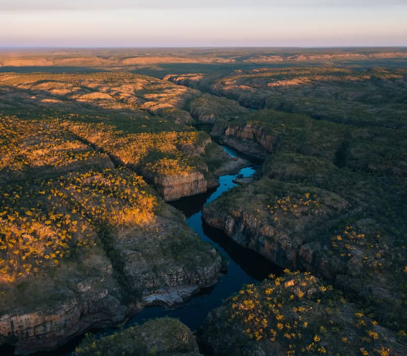 High-angle aerial view of the winding Katherine River through sandstone walls.
