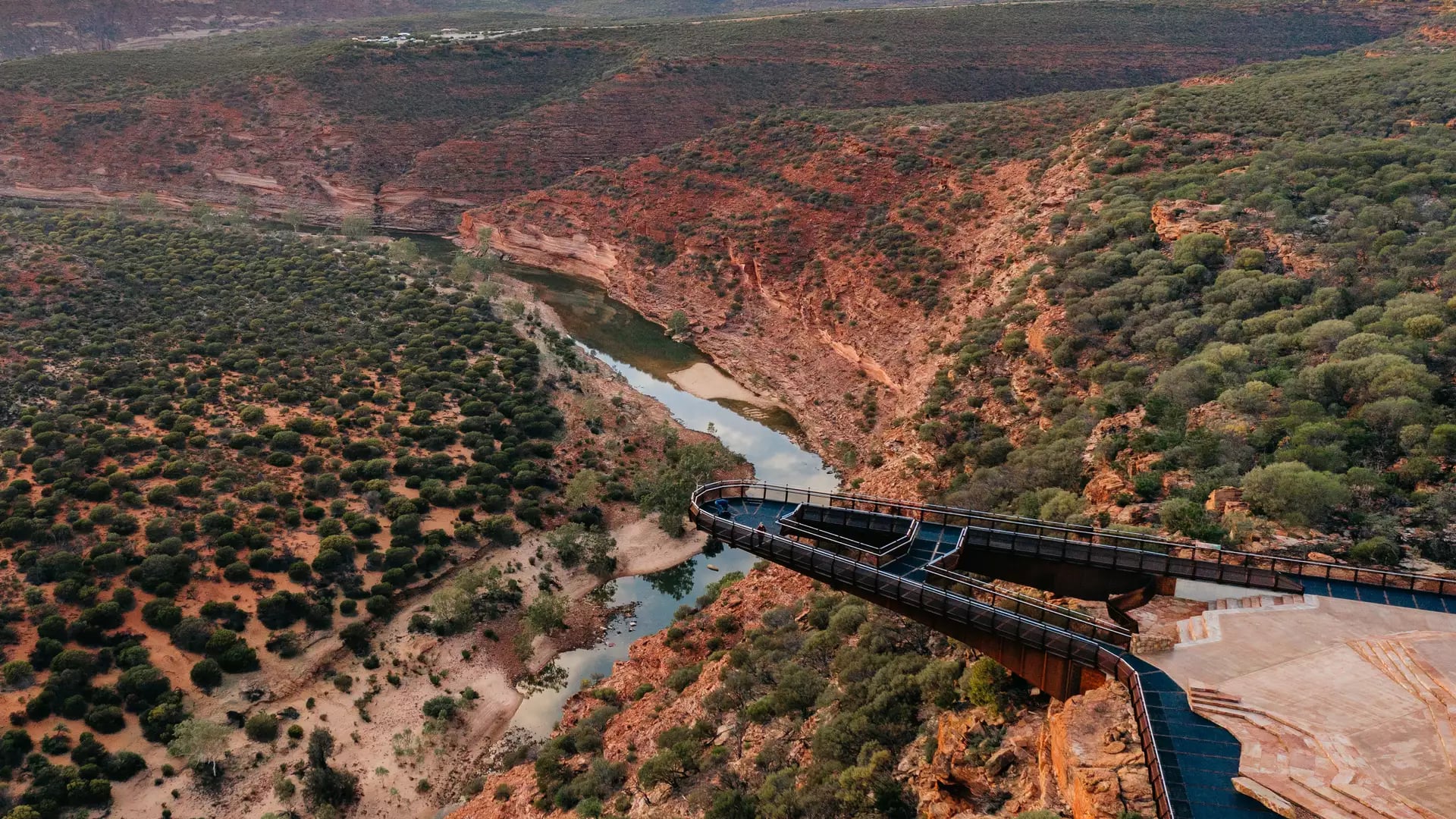 Kalbarri Skywalk (Kaju Yatka) during sunset, highlighting the architecture of the cantilevered platform against the Murchison River Gorge.