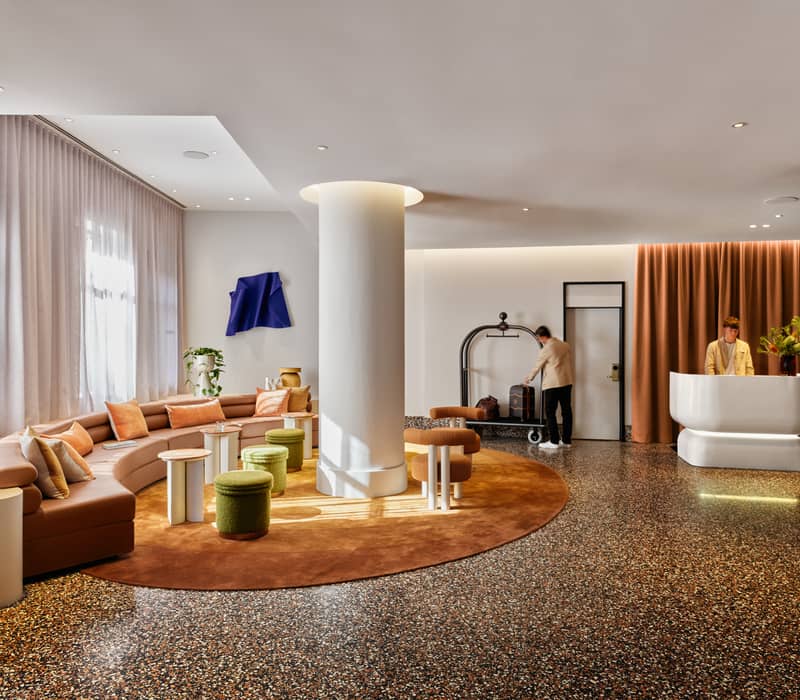 Modern king bedroom suite with soft lighting and city window view at Adina Apartment Hotel Sydney Town Hall.