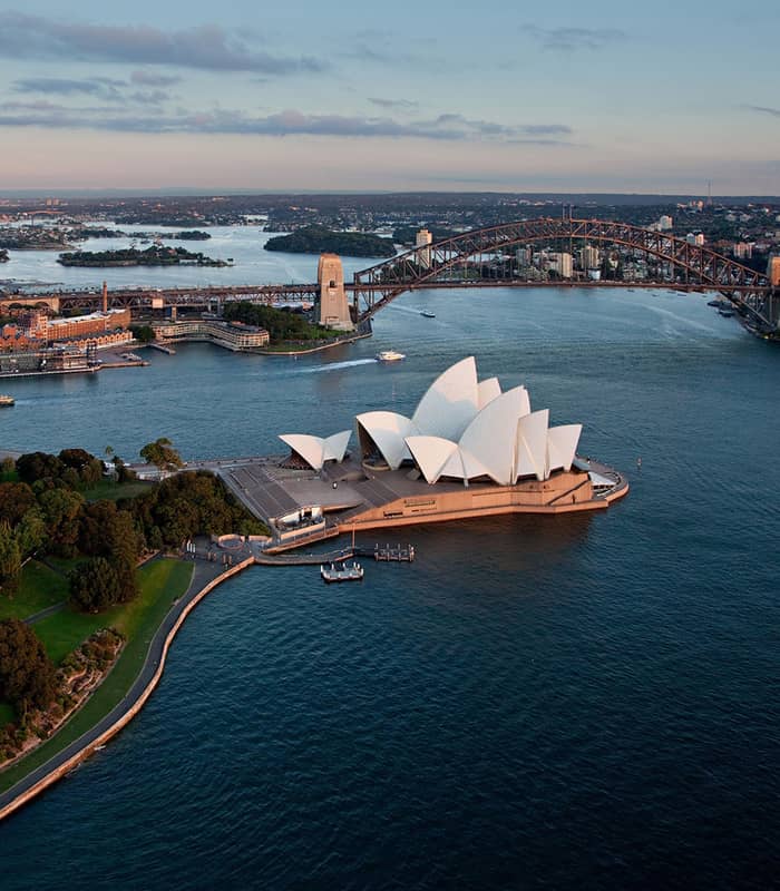 Aerial view of Sydney Harbour with Opera House and Harbour Bridge.
