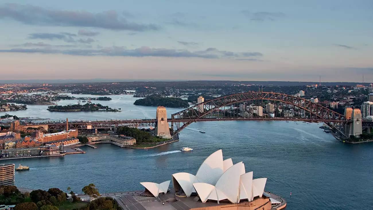 Aerial view of Sydney Harbour with Opera House and Harbour Bridge.