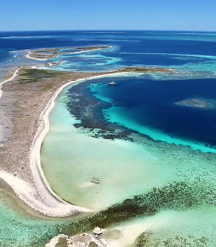 The breathtaking lagoons and white sand cays of the Abrolhos Islands, a highlight of an Eco Abrolhos Cruise in Western Australia.