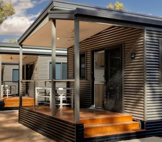 Modern holiday cabins with timber decks at Discovery Parks Renmark Riverfront in South Australia's Riverland region.