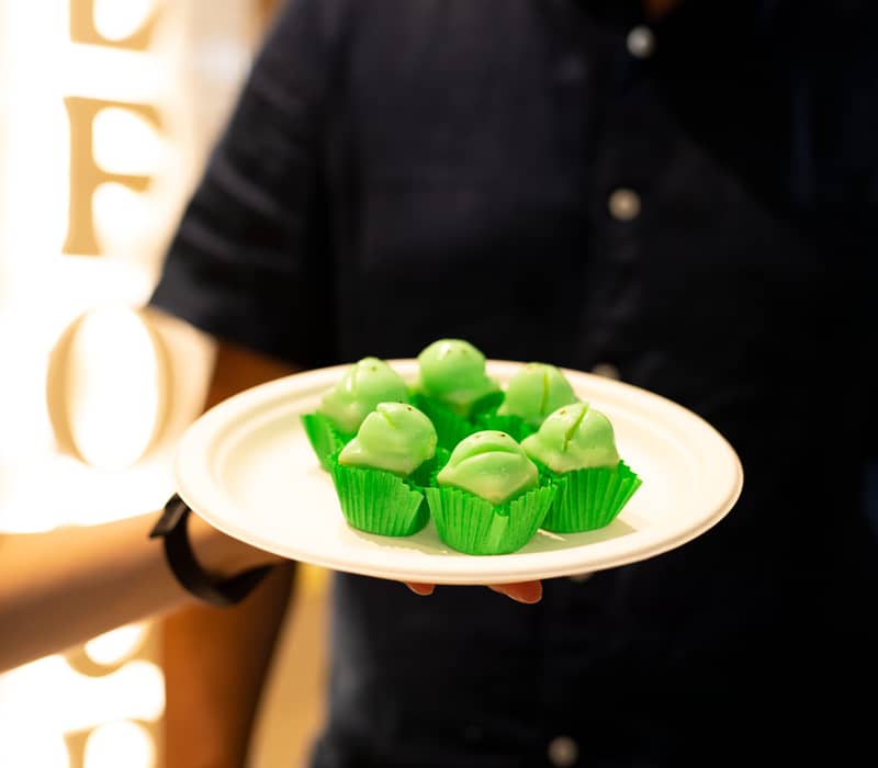 A tray of green Balfours frog cakes, a famous South Australian fondant-covered sponge dessert.