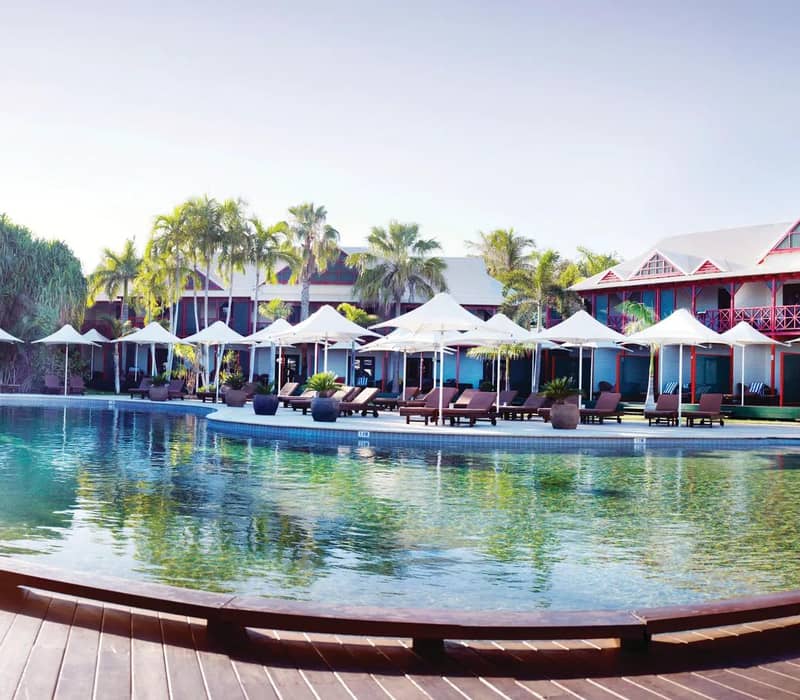 Serene pool at Cable Beach Club Resort & Spa with tropical surroundings.
