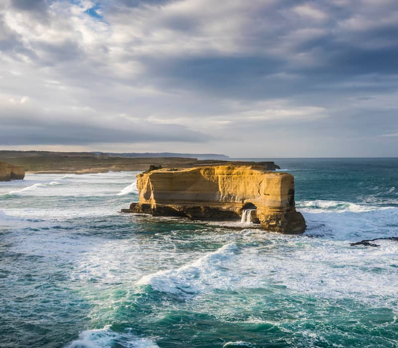 The Baker's Oven rising majestically from the Southern Ocean along the dramatic coastline of Victoria, Australia, viewed from a lookout point.