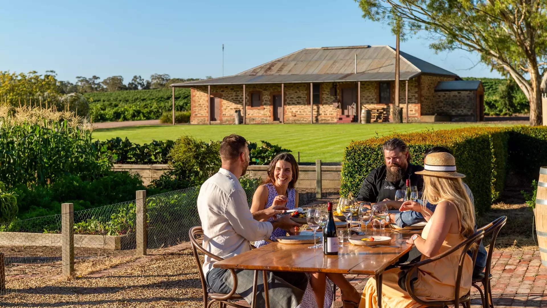 An outdoor dining experience at St Hugo winery featuring local wine and gourmet food in the Barossa Valley.