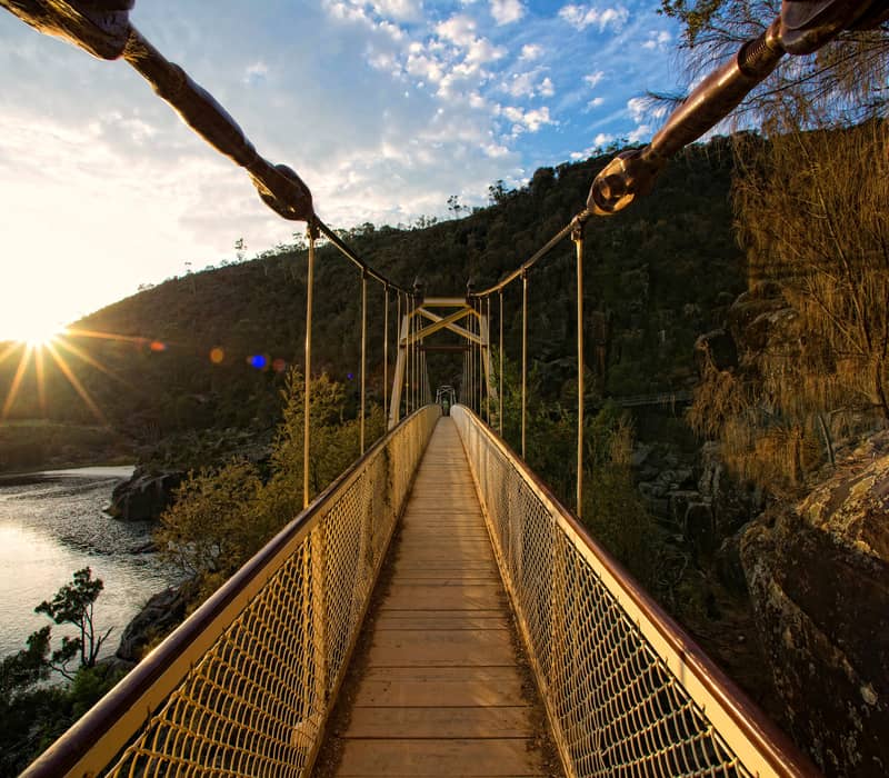 View along the Alexandra Suspension Bridge over the South Esk River in Cataract Gorge, Launceston, Tasmania at sunset